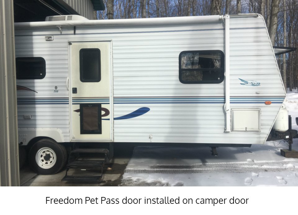 Large door-mounted Freedom Pet Pass dog door on camper